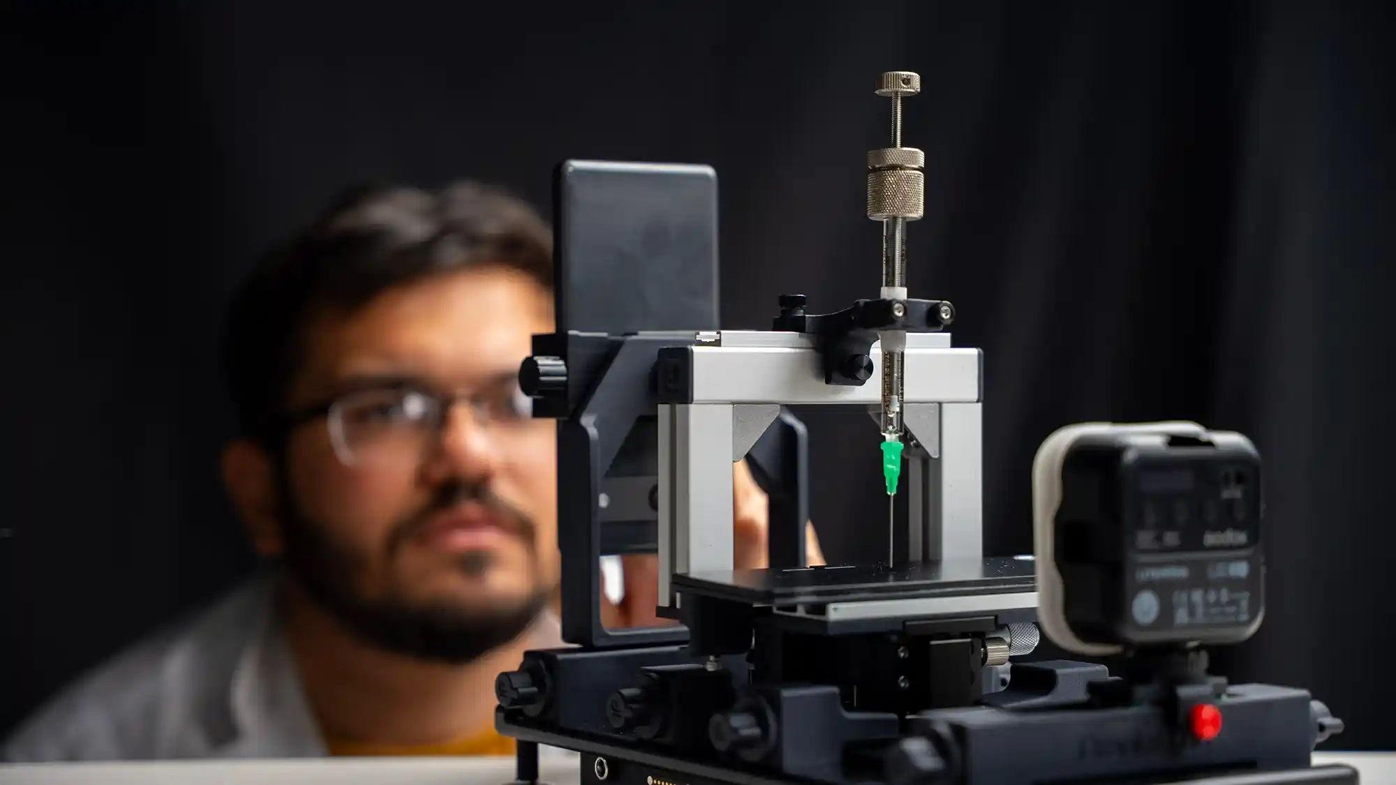 Researcher with dropometer